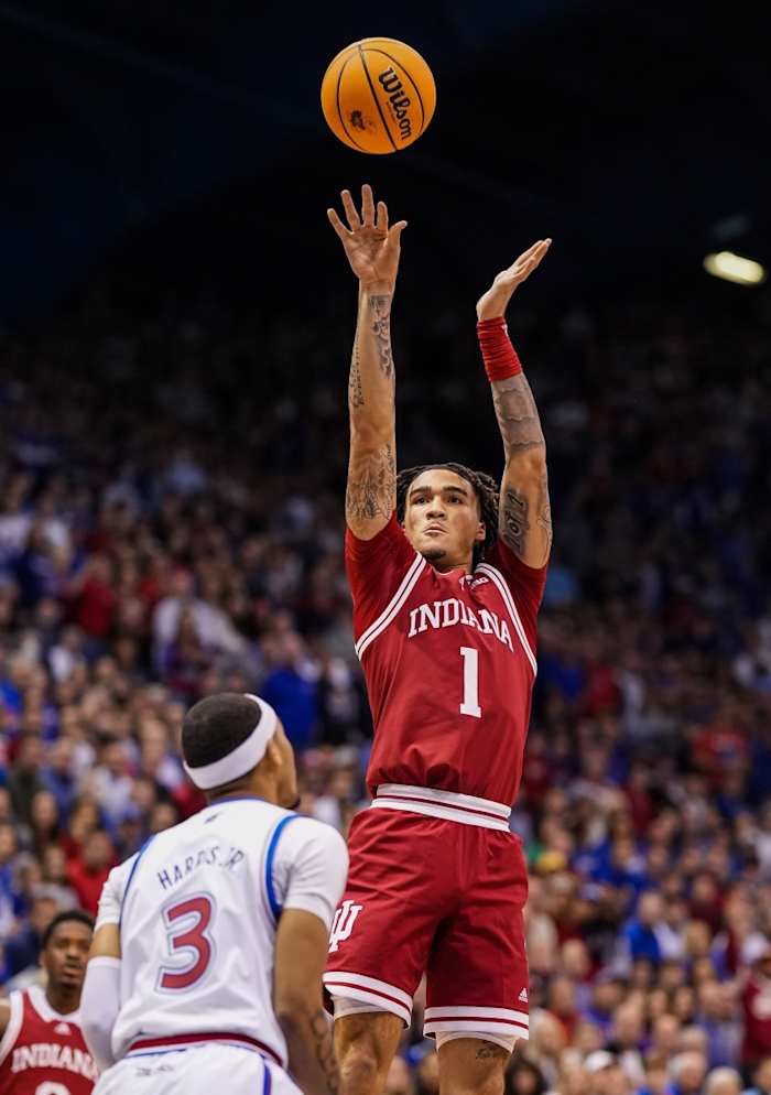 Indiana guard Jalen Hood-Schifino (1) shoots over Kansas guard Dajuan Harris Jr. (3) during the first half on Saturday, (Jay Biggerstaff-USA TODAY Sports)